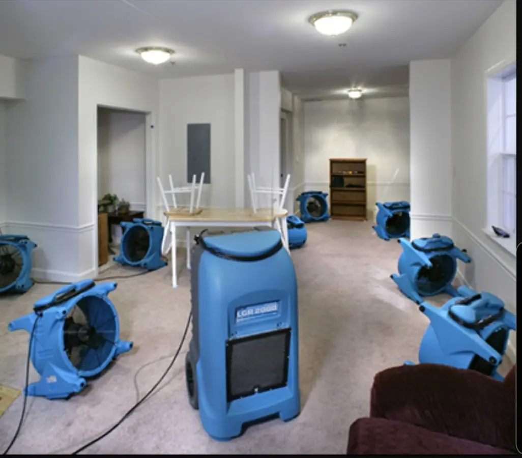 Air movers and dehumidifier setup for Water Damage Restoration in Lockhart